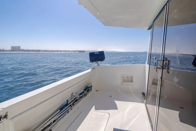 Slide: The Image of 2007 Navigator Pilothouse yacht deck with ocean view and glass doors. - 28
