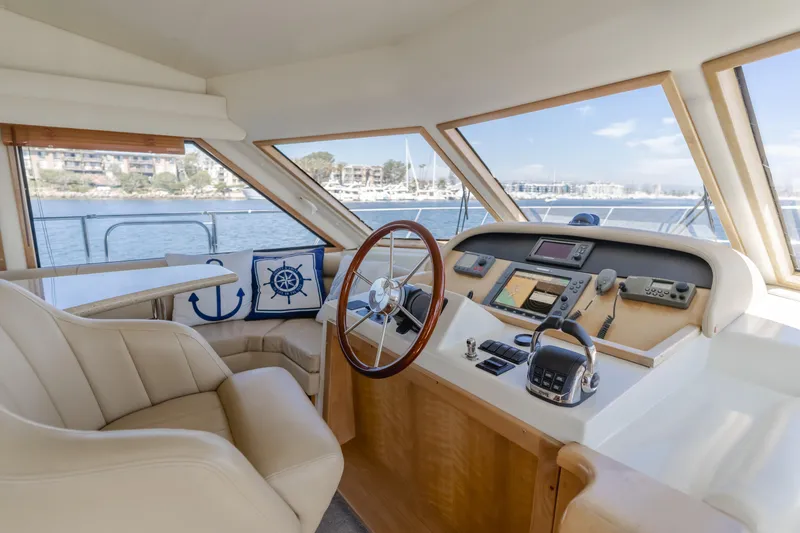 Slide: The Image of 2007 Navigator Pilothouse yacht interior with steering wheel and navigation equipment. - 31