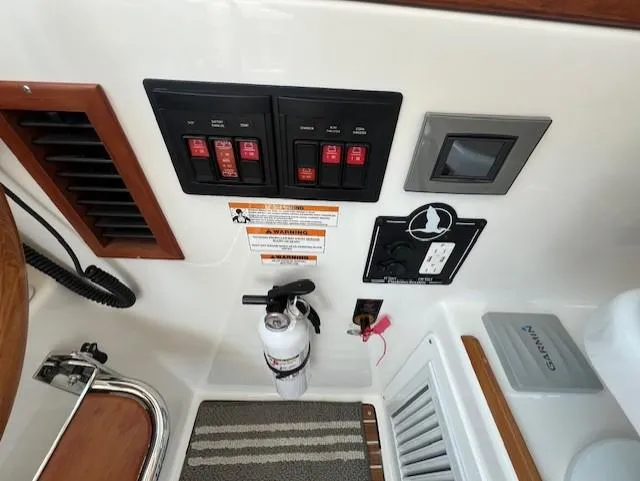 Slide: The Image of Control panel and safety equipment on a 2020 Back Cove 37 boat. - 12