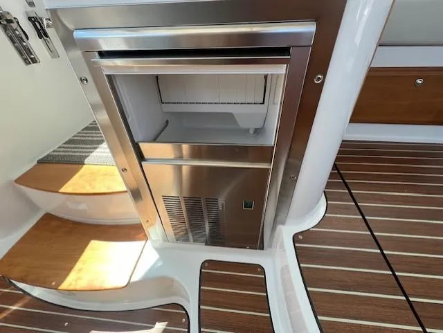 Slide: The Image of Stainless steel refrigerator on 2020 Back Cove 37 yacht with wooden flooring. - 15