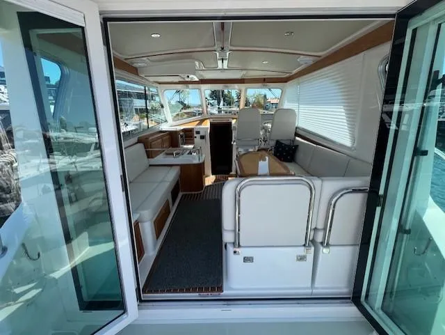 Slide: The Image of Interior view of 2020 Back Cove 37 yacht, featuring elegant seating and modern design. - 4