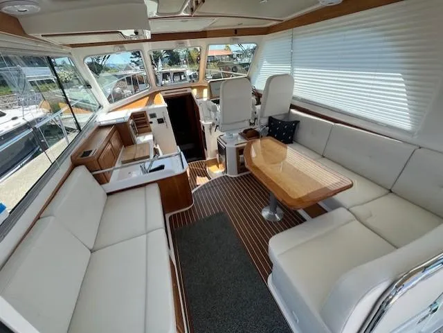 Slide: The Image of Interior of 2020 Back Cove 37 yacht with elegant seating and wooden accents. - 5