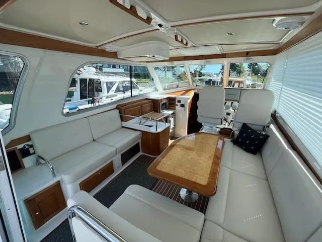 Slide: The Image of Luxurious interior of a 2020 Back Cove 37 yacht with elegant seating and wooden accents. - 6
