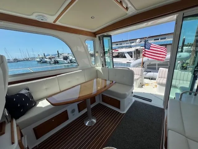 Slide: The Image of Interior of 2020 Back Cove 37 yacht with seating and table, docked at marina. - 8