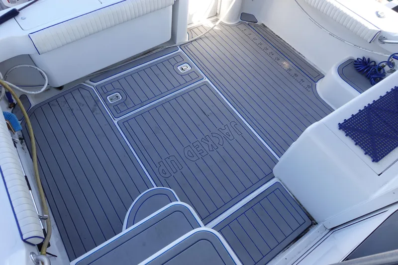 Slide: The Image of 2001 Luhrs 36 Convertible boat deck with custom non-slip flooring and seating. - 11