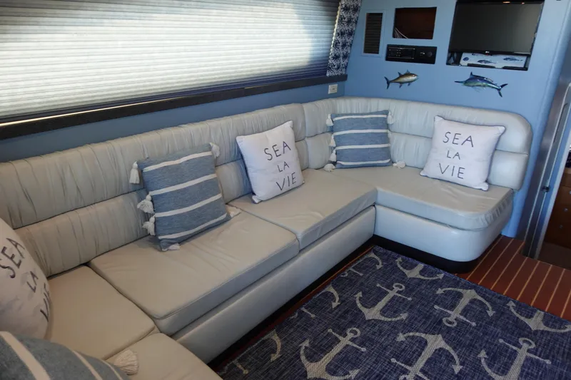 Slide: The Image of Luhrs 36 Convertible 2001 interior with nautical-themed decor and comfortable seating. - 20