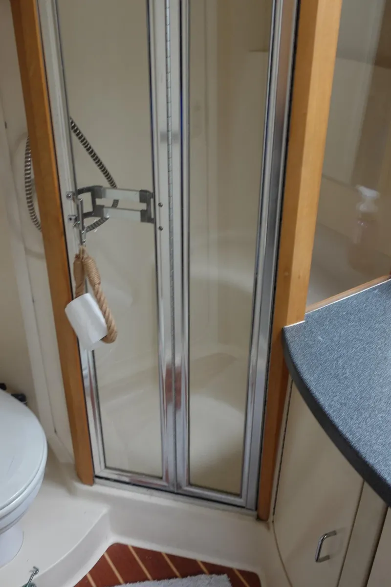 Slide: The Image of Bathroom interior of 2001 Luhrs 36 Convertible yacht with shower and toilet. - 30