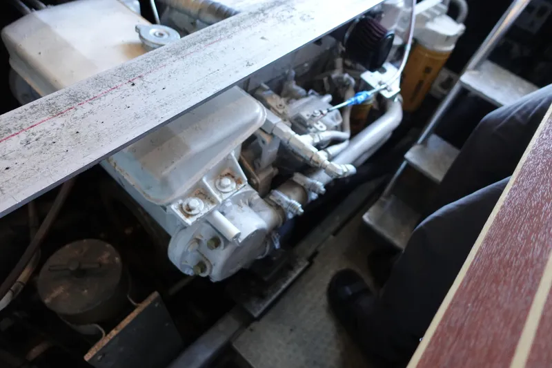 Slide: The Image of Engine compartment of a 2001 Luhrs 36 Convertible boat, showcasing mechanical components. - 34