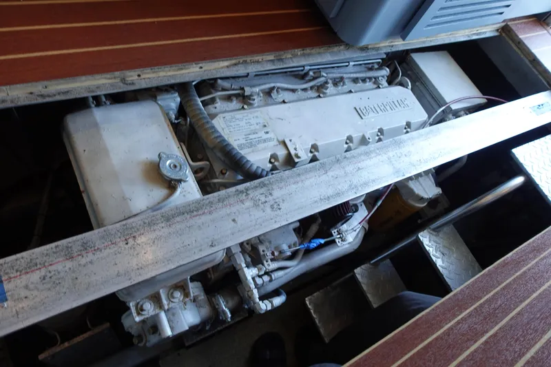 Slide: The Image of Engine compartment of a 2001 Luhrs 36 Convertible boat, showcasing mechanical components. - 35