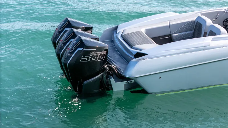Slide: The Image of 2017 Nor-Tech 3900 Super-VEE with triple outboard engines on clear water. - 1
