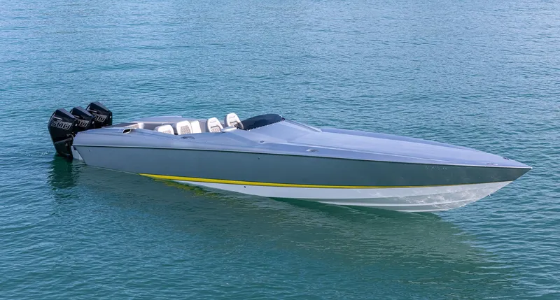 Slide: The Image of 2017 Nor-Tech 3900 Super-VEE speedboat on clear blue water. - 10