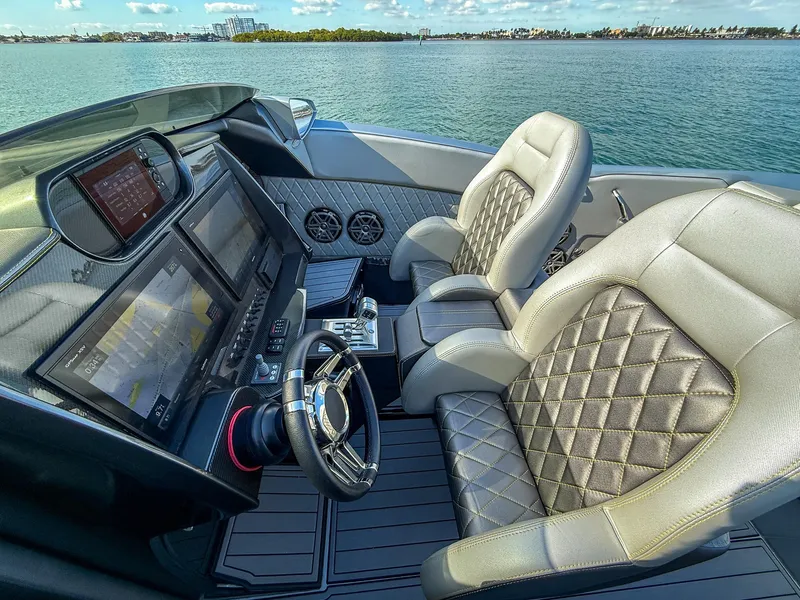 Slide: The Image of 2017 Nor-Tech 3900 Super-VEE cockpit with luxurious seating and advanced navigation system. - 11