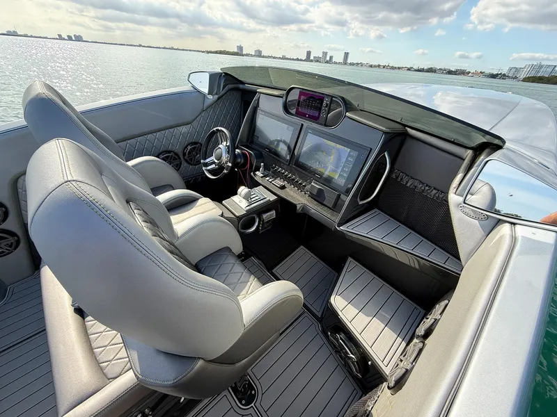 Slide: The Image of 2017 Nor-Tech 3900 Super-VEE cockpit with modern controls and dual seats on the water. - 14