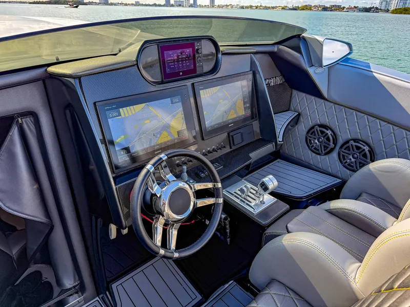 Slide: The Image of 2017 Nor-Tech 3900 Super-VEE cockpit with dual screens and luxury seating. - 22