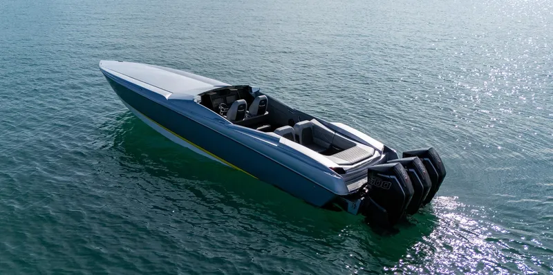 Slide: The Image of 2017 Nor-Tech 3900 Super-VEE speedboat on calm water, featuring powerful outboard engines. - 24