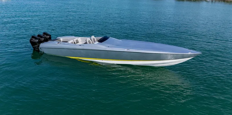 Slide: The Image of 2017 Nor-Tech 3900 Super-VEE speedboat on calm water. - 26