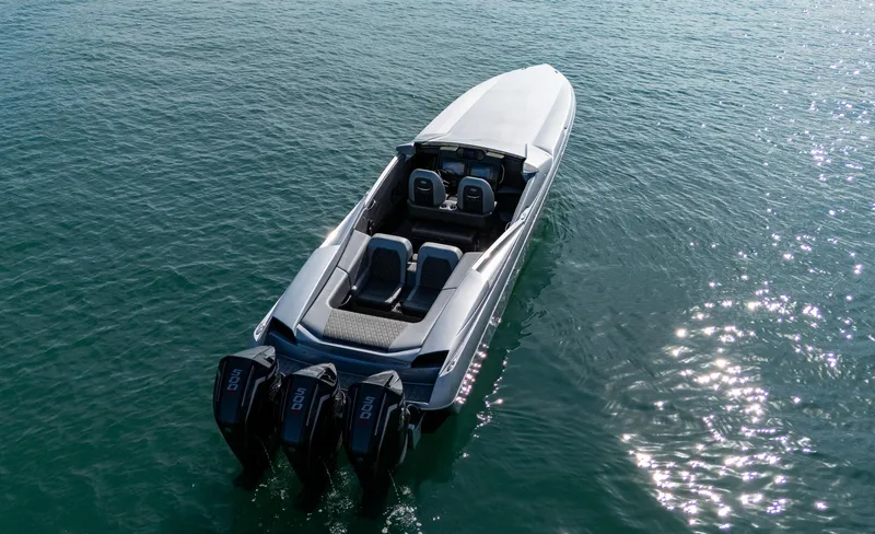 Slide: The Image of 2017 Nor-Tech 3900 Super-VEE boat with triple engines on calm water. - 30
