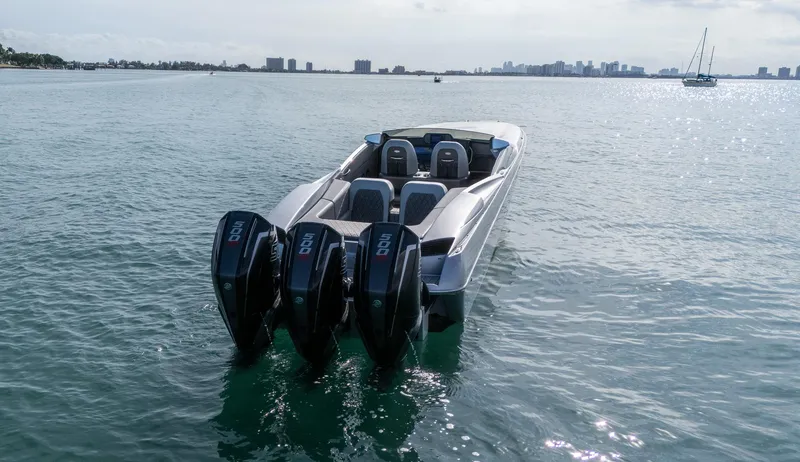 Slide: The Image of 2017 Nor-Tech 3900 Super-VEE speedboat with triple outboard engines on open water. - 31