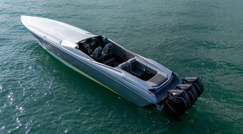 Slide: The Image of 2017 Nor-Tech 3900 Super-VEE speedboat on water with powerful outboard engines. - 33