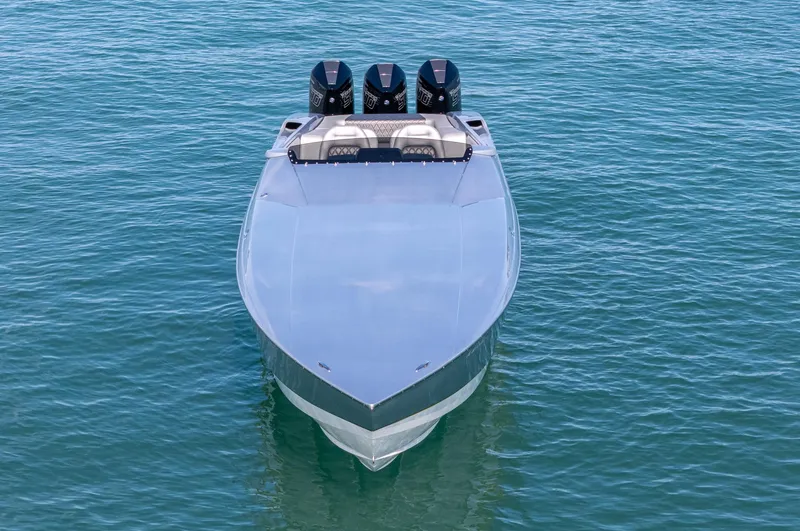 Slide: The Image of 2017 Nor-Tech 3900 Super-VEE boat with triple engines on calm water. - 35