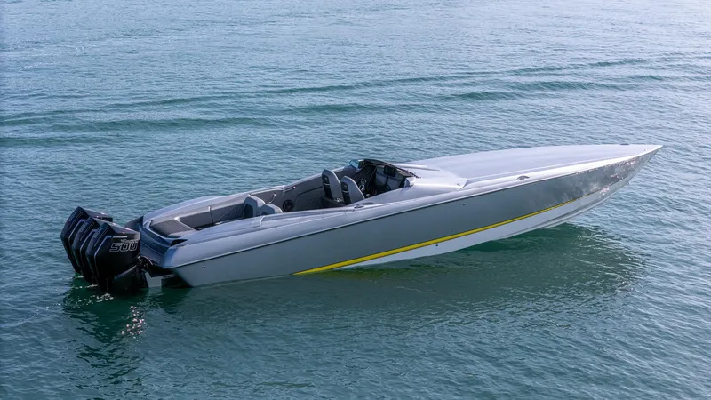 Slide: The Image of 2017 Nor-Tech 3900 Super-VEE speedboat on calm water, featuring sleek design and powerful engines. - 36