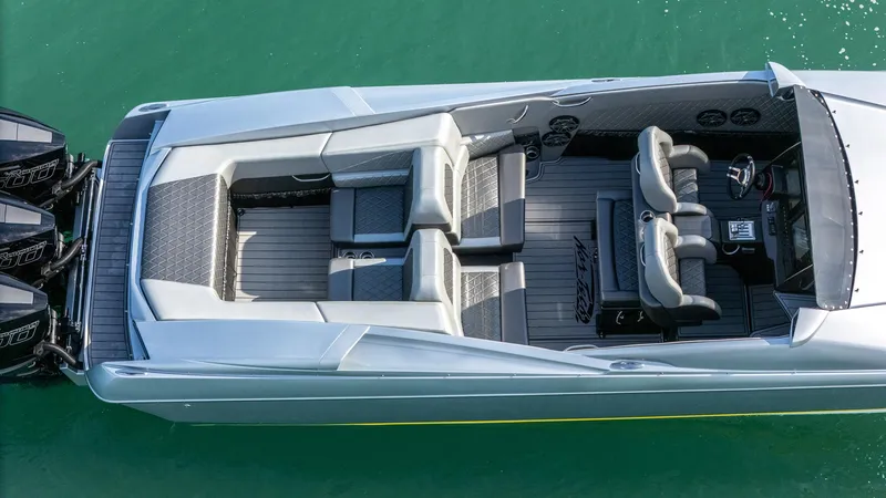 Slide: The Image of 2017 Nor-Tech 3900 Super-VEE boat, aerial view, sleek design, spacious seating, triple engines. - 37