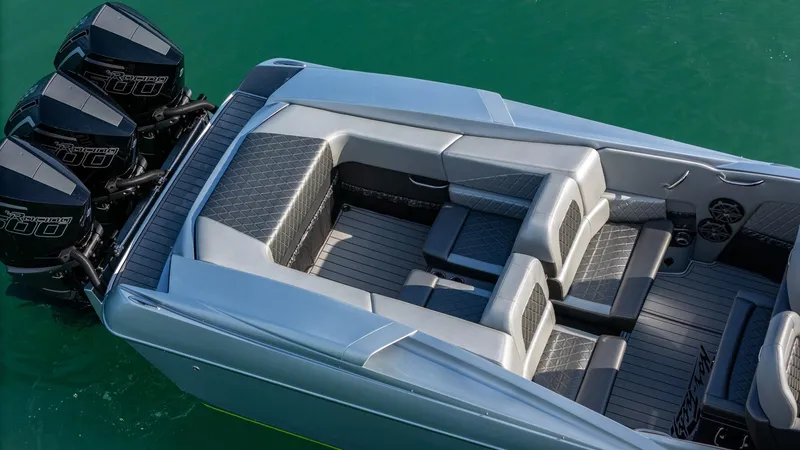 Slide: The Image of 2017 Nor-Tech 3900 Super-VEE boat with triple engines on turquoise water. - 4