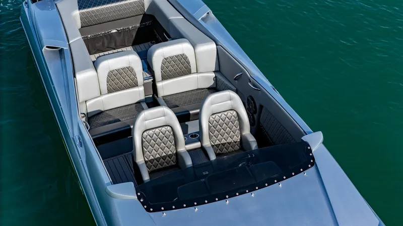 Slide: The Image of 2017 Nor-Tech 3900 Super-VEE boat interior with luxurious seating on water. - 44