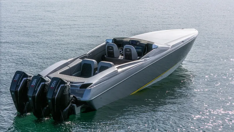 Slide: The Image of 2017 Nor-Tech 3900 Super-VEE speedboat with triple outboard engines on calm water. - 47