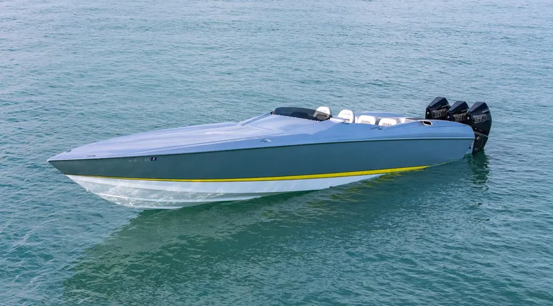 Slide: The Image of 2017 Nor-Tech 3900 Super-VEE speedboat on calm blue water. - 8