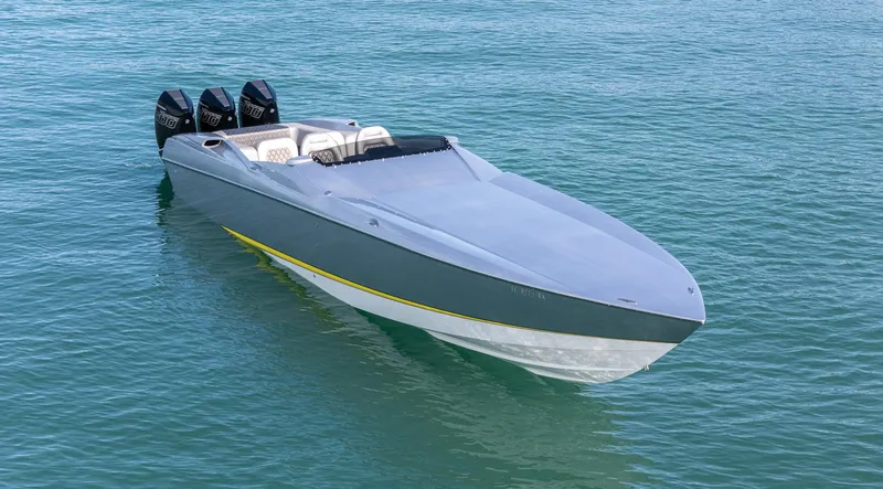 Slide: The Image of 2017 Nor-Tech 3900 Super-VEE speedboat on clear blue water. - 9