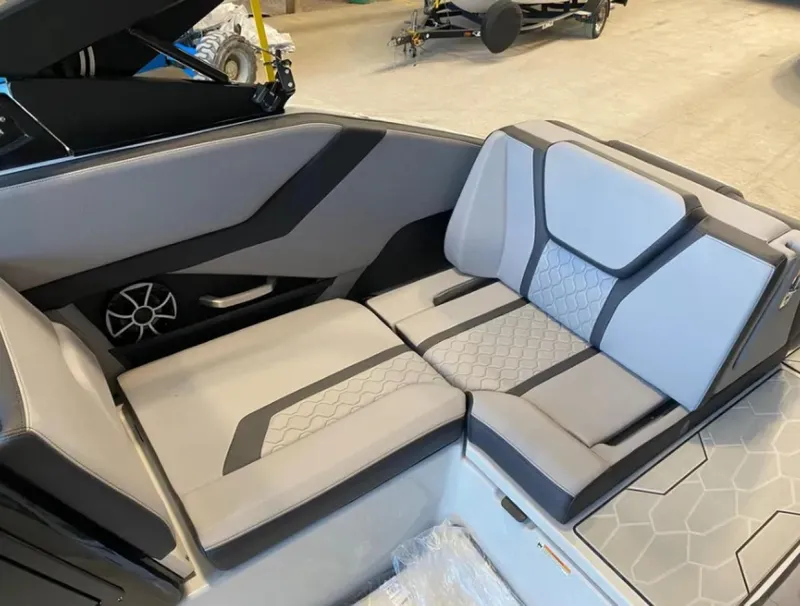 Slide: The Image of 2024 Yamaha Boats 255XE interior seating with modern design and premium upholstery. - 10