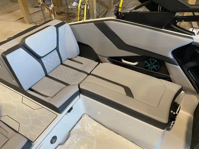 Slide: The Image of 2024 Yamaha Boats 255XE interior with sleek, modern seating design. - 11