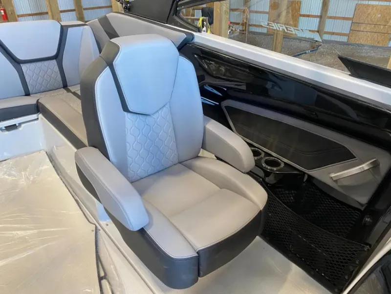 Slide: The Image of 2024 Yamaha Boats 255XE interior with gray seating and modern design. - 7