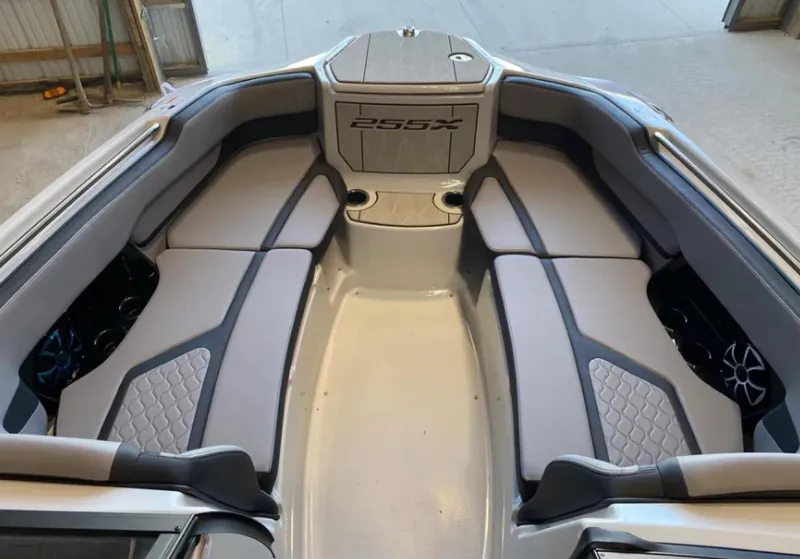 Slide: The Image of 2024 Yamaha Boats 255XE interior with sleek seating and modern design. - 9
