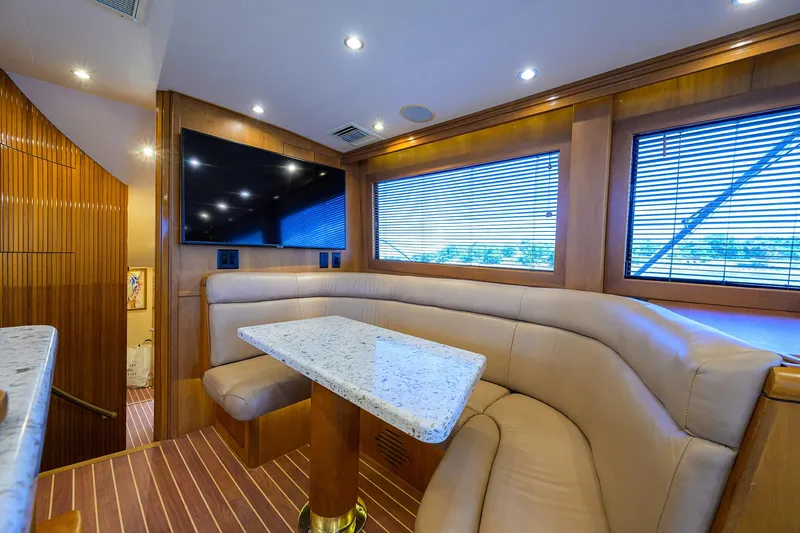 Slide: The Image of Luxurious interior of 2001 Hatteras 60 Convertible yacht with plush seating and modern amenities. - 17