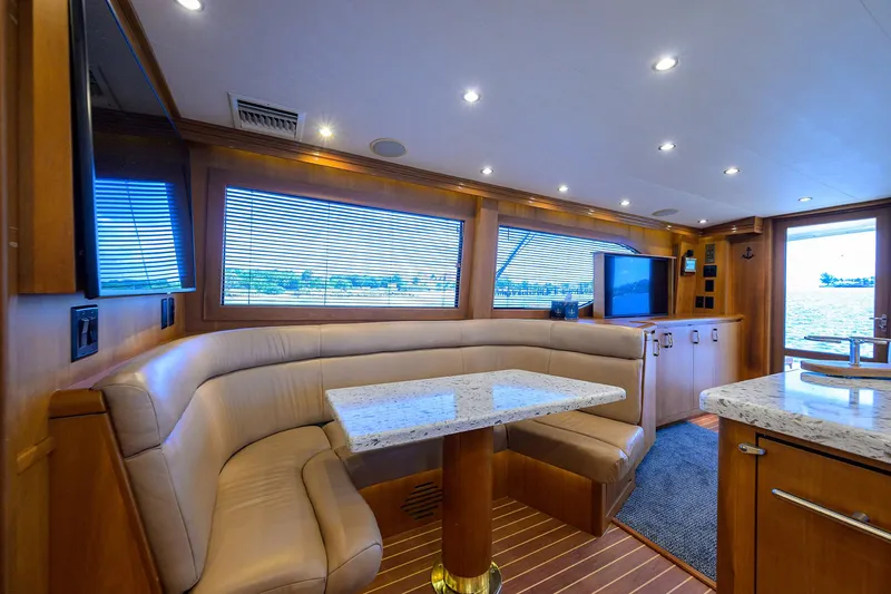 Slide: The Image of Luxurious interior of 2001 Hatteras 60 Convertible yacht with plush seating and modern amenities. - 18
