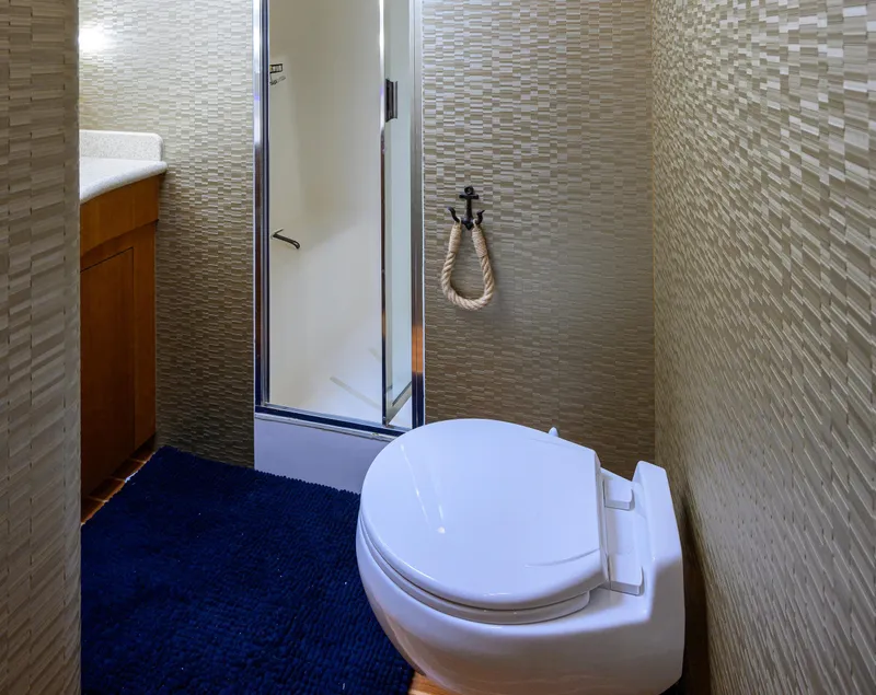 Slide: The Image of Bathroom interior of 2001 Hatteras 60 Convertible yacht with shower and toilet. - 26