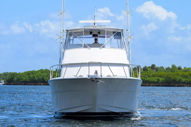 Slide: The Image of Front view of 2001 Hatteras 60 Convertible yacht on water. - 40