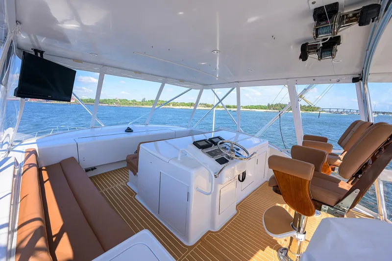 Slide: The Image of Spacious helm of 2001 Hatteras 60 Convertible yacht with ocean view. - 48