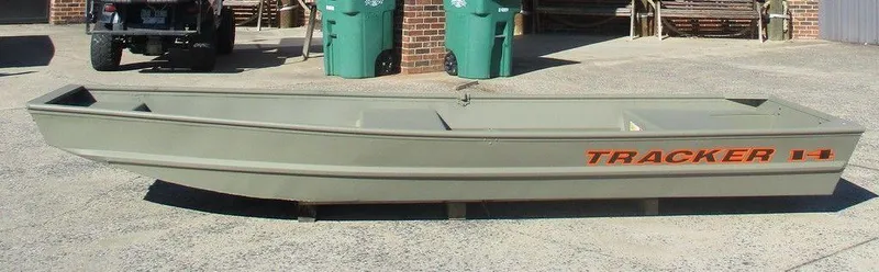 The Image of 2024 Tracker Grizzly® 1436 Jon boat in a driveway, side view. - 1