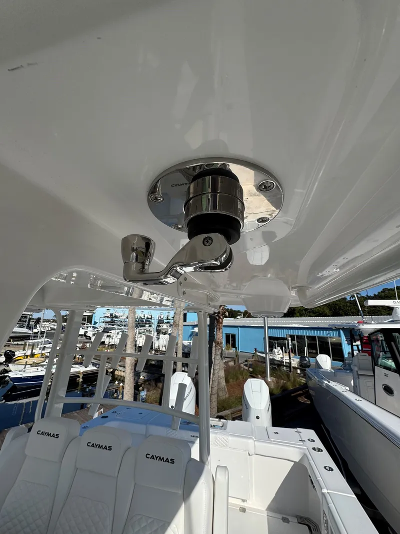 Slide: The Image of 2025 Caymas 34 CT boat interior with stainless steel fixtures and seating. - 15