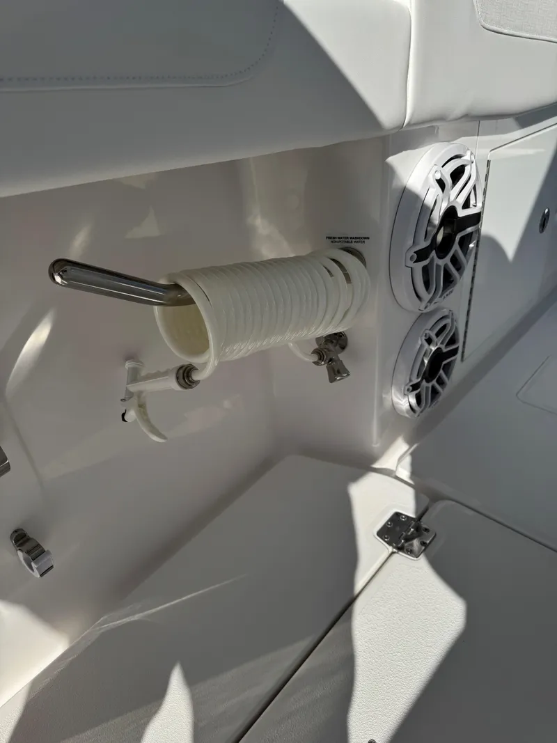 Slide: The Image of 2025 Caymas 34 CT boat interior with speakers and rod holder. - 19