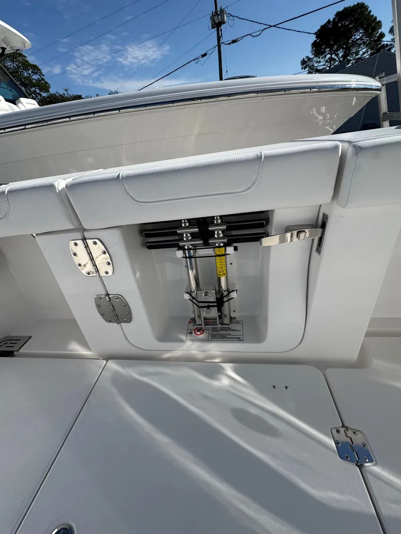 Slide: The Image of 2025 Caymas 34 CT boat deck with hydraulic system and storage compartments. - 20
