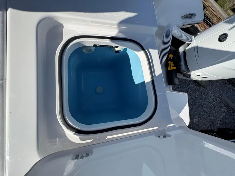 Slide: The Image of 2025 Caymas 34 CT boat livewell with open lid, showcasing interior. - 21