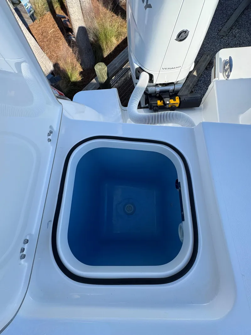 Slide: The Image of Livewell on 2025 Caymas 34 CT boat, featuring a clean, blue interior. - 22