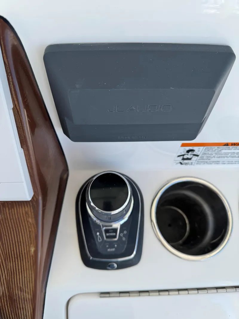 Slide: The Image of 2025 Caymas 34 CT boat control panel with joystick and cup holder. - 29