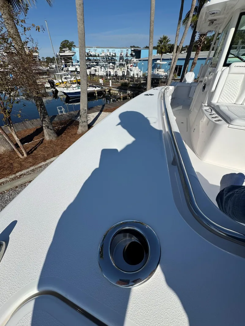 Slide: The Image of 2025 Caymas 34 CT boat deck with marina view and shadow. - 30