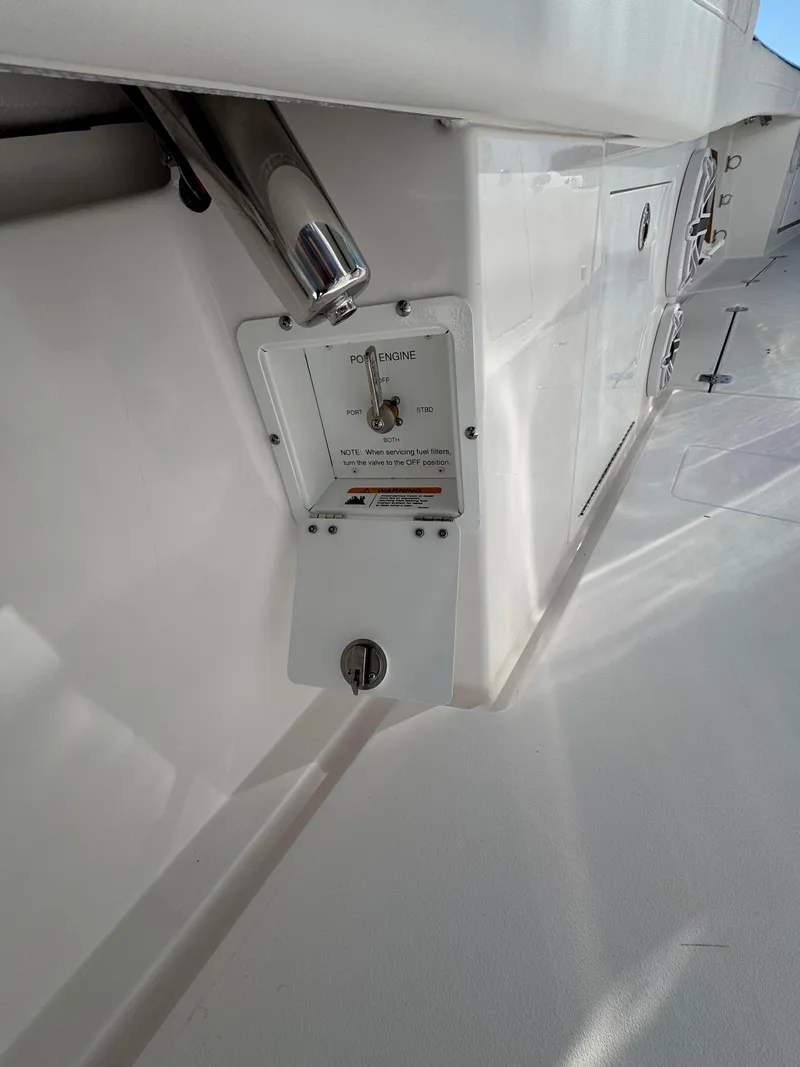 Slide: The Image of 2025 Caymas 34 CT boat deck with control panel and storage compartments. - 31