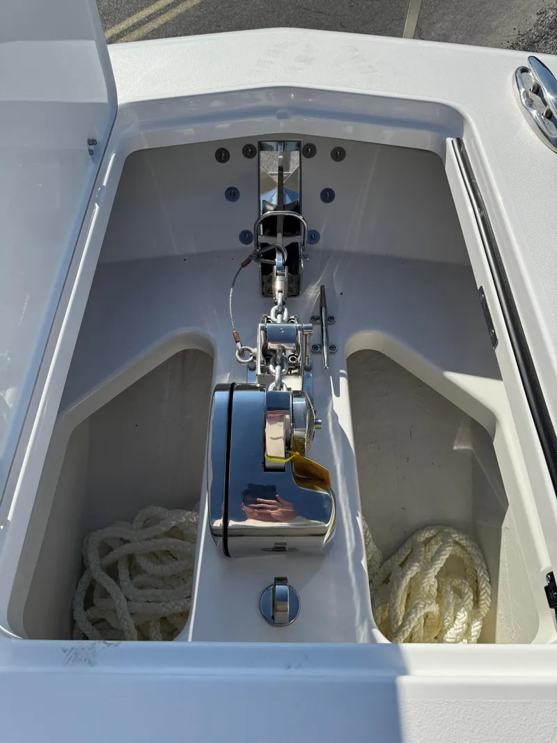 Slide: The Image of 2025 Caymas 34 CT boat anchor compartment with ropes and winch. - 33